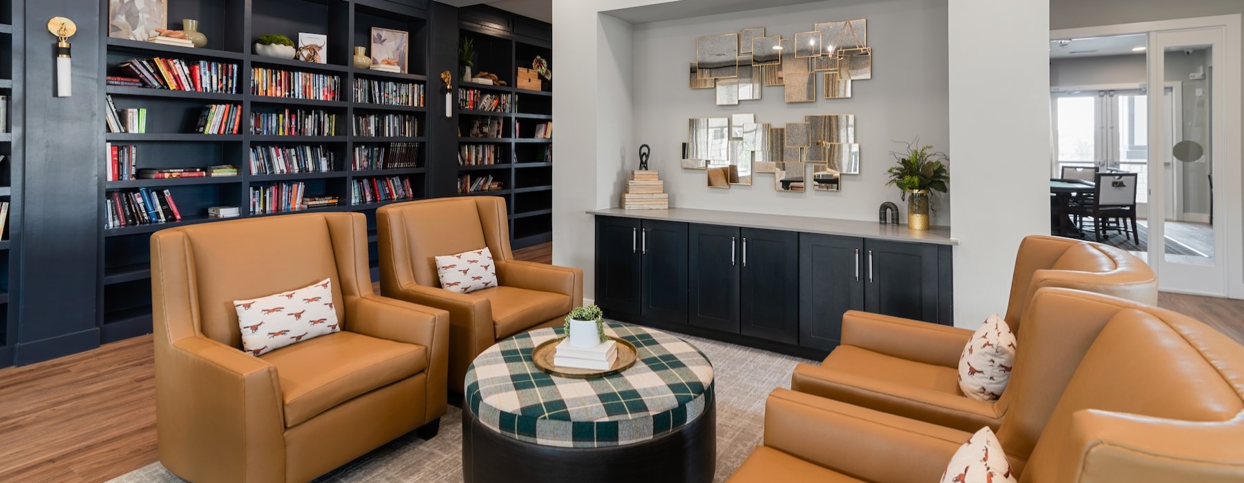 a clubroom with books and chairs