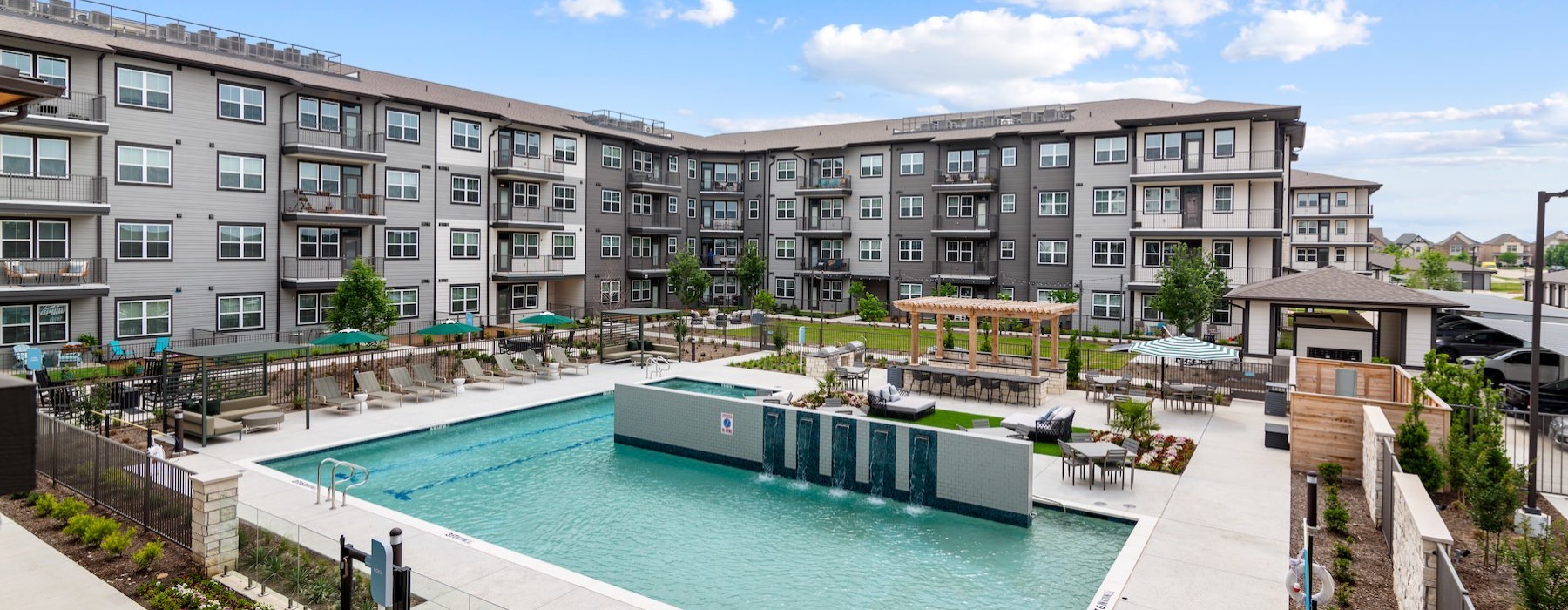 a swimming pool in front of a building