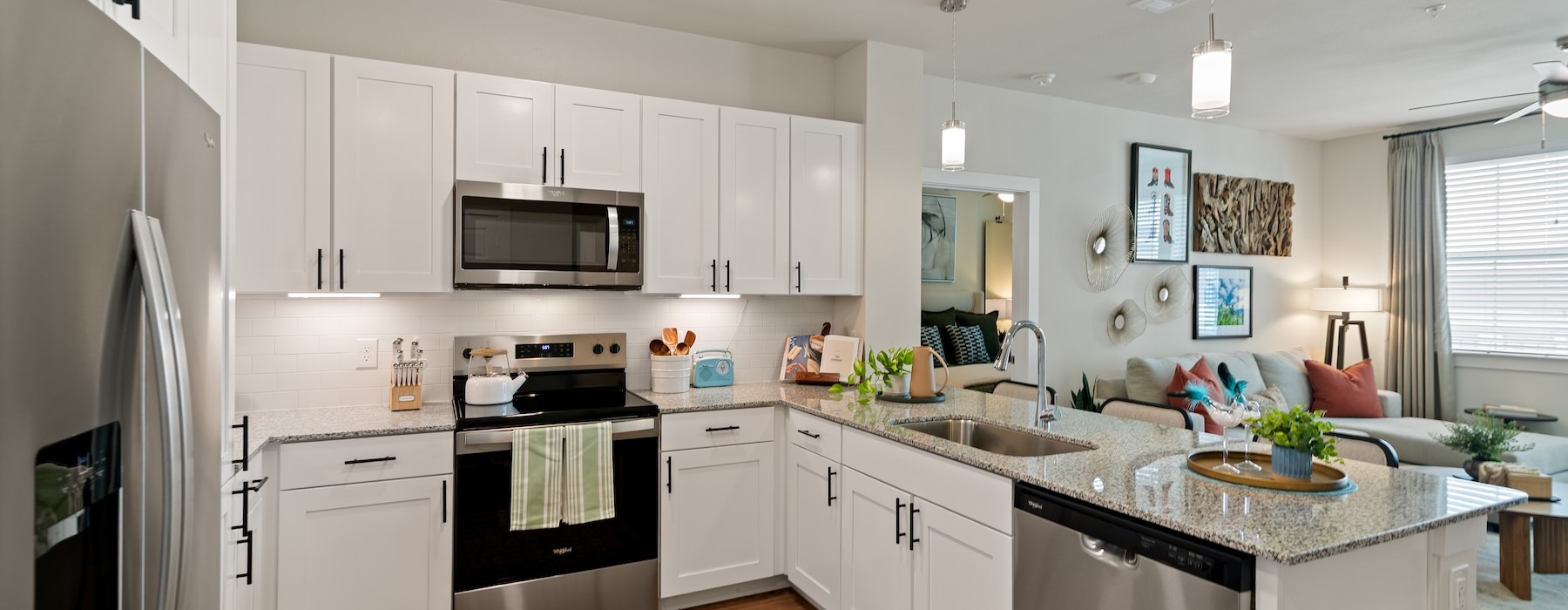 a kitchen with white cabinets