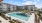 a swimming pool in front of a building
