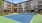 a tennis court in front of a building