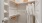 a closet with white clothes
